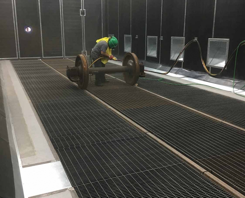 Surface preparation plant for train wheels