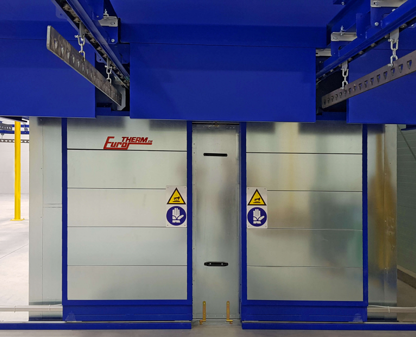 Curing oven with overhead conveyor