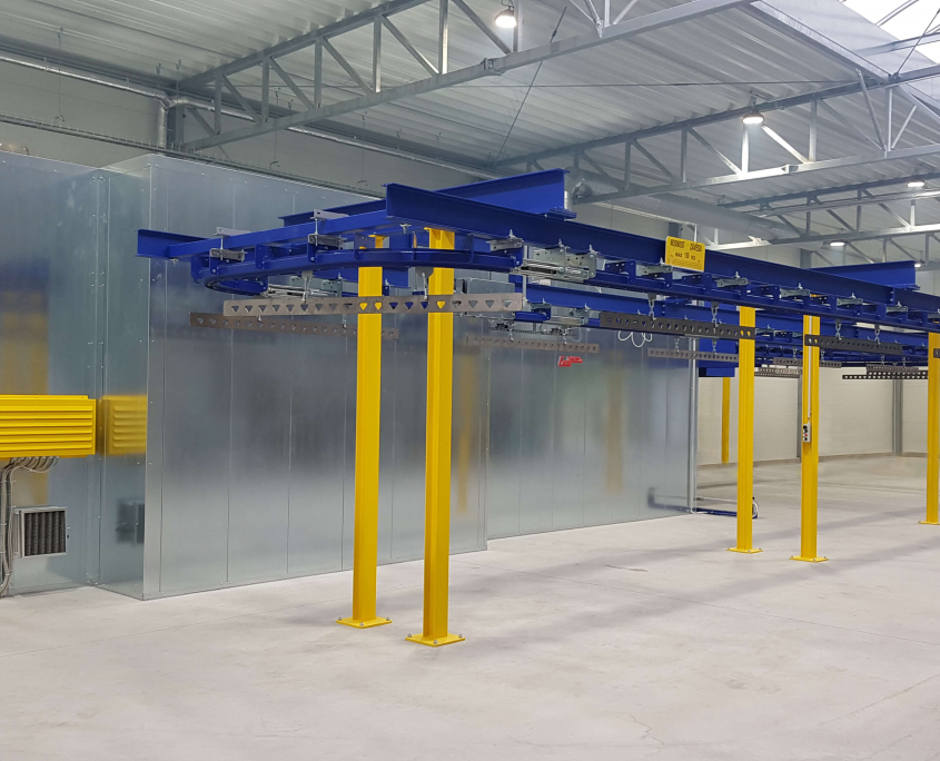 Curing oven with overhead conveyor
