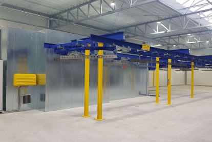 Curing oven with overhead conveyor