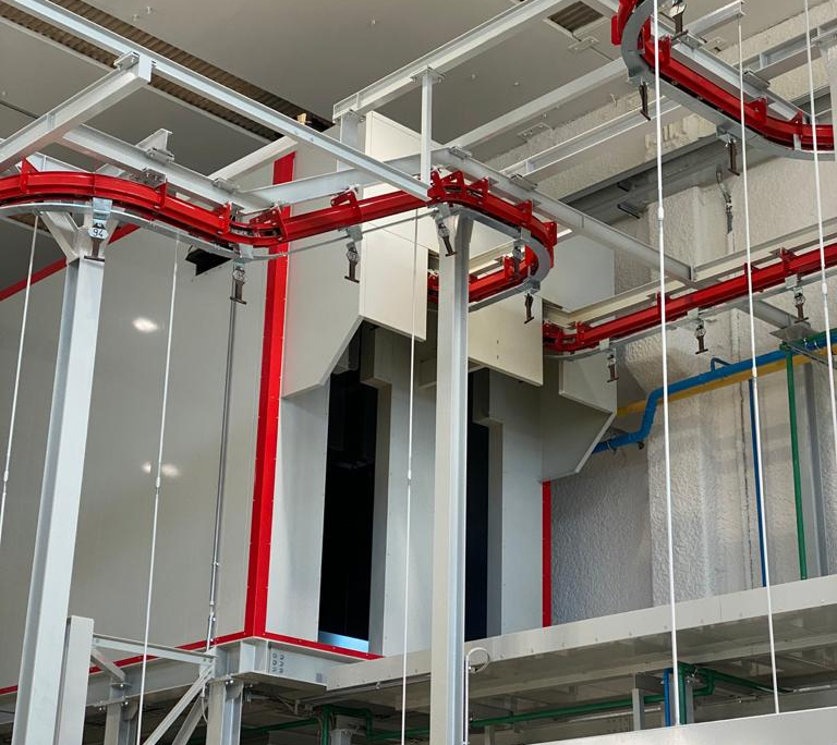 Fully automated high-production rate powder painting plant