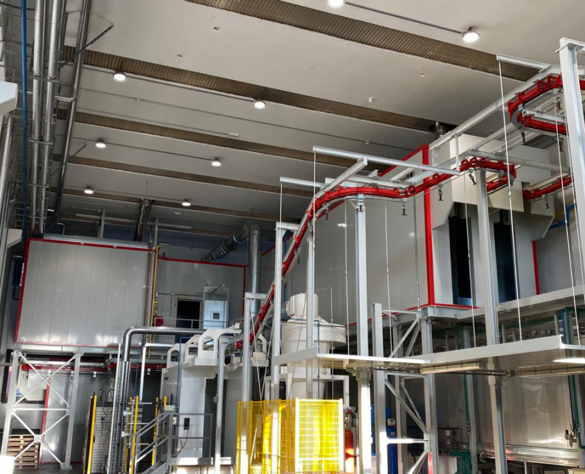 Fully automated high-production rate powder painting plant