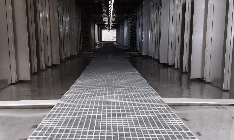 Tunnels de prétraitement des essieux de tracteurs